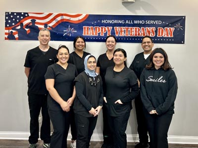 the Smiles Dental Center team celebrating Veteran's Day in their office