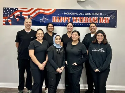 the Smiles Dental Center team celebrating Veteran's Day in their office