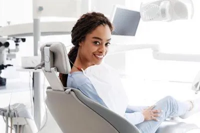 patient relieved of her tooth pain during her visit to Smiles Dental Center